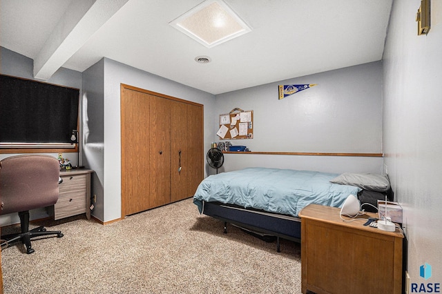 carpeted bedroom featuring a closet