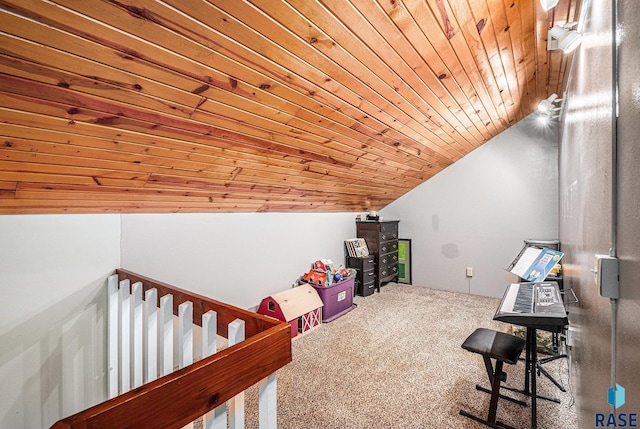 interior space featuring vaulted ceiling, wooden ceiling, and carpet flooring