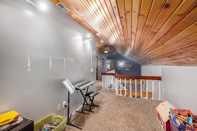 interior space with wood ceiling, vaulted ceiling, and carpet