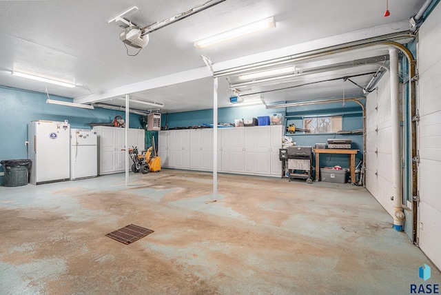 garage featuring a garage door opener and white refrigerator