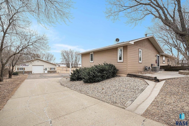 view of side of property with an outbuilding and a garage