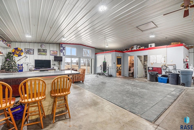 interior space with ceiling fan