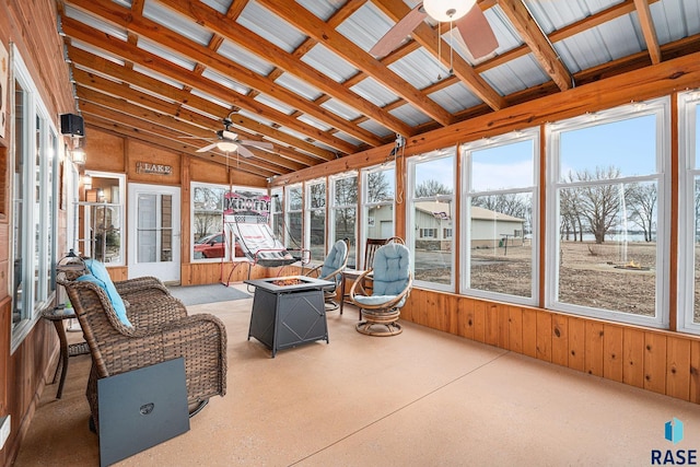 sunroom with lofted ceiling and ceiling fan