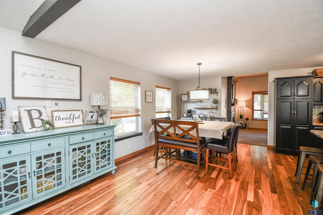 dining area with light hardwood / wood-style flooring