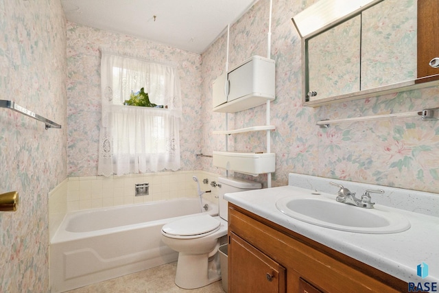 bathroom featuring vanity, a bath, and toilet