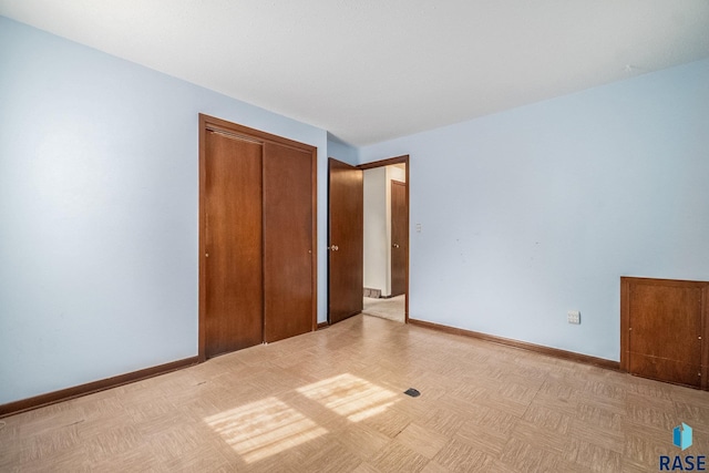 unfurnished bedroom with a closet