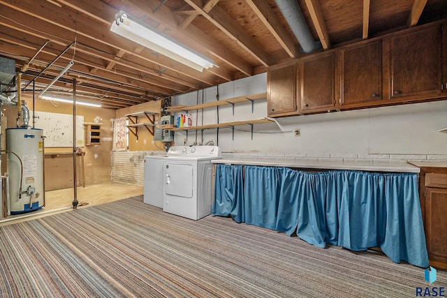 clothes washing area featuring washing machine and dryer and water heater