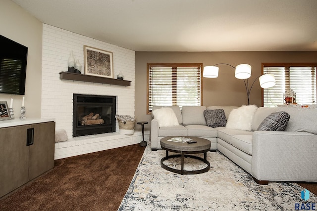 carpeted living room with plenty of natural light and a fireplace