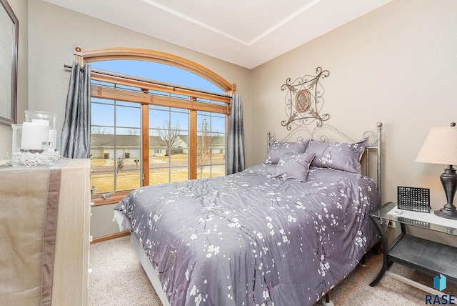 bedroom with light colored carpet