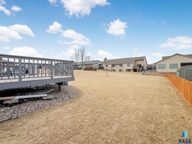 view of yard with a wooden deck