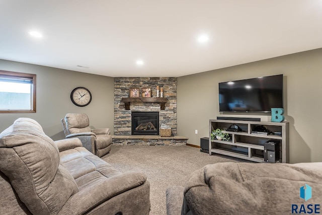 living room featuring a fireplace and carpet