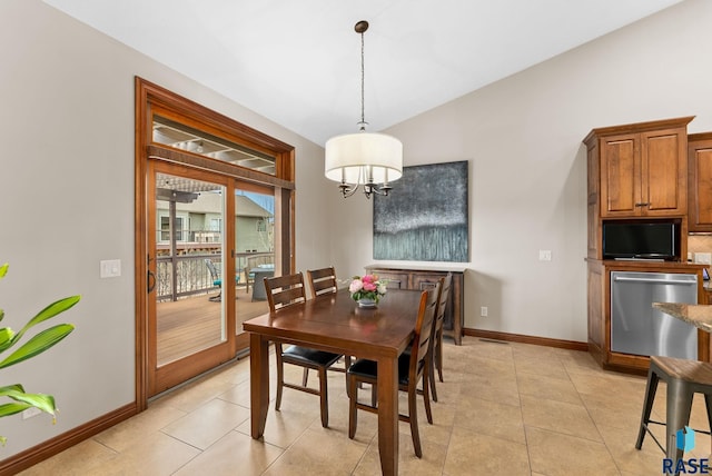 dining area with a notable chandelier, lofted ceiling, and light tile patterned floors