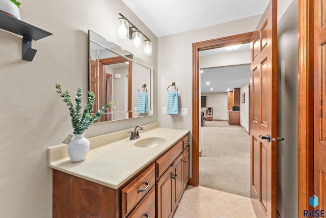 bathroom with tile patterned floors and vanity