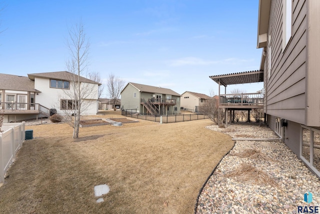 view of yard with a pergola and a deck