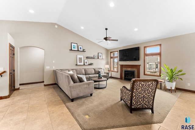 living room with light tile patterned floors, high vaulted ceiling, and ceiling fan