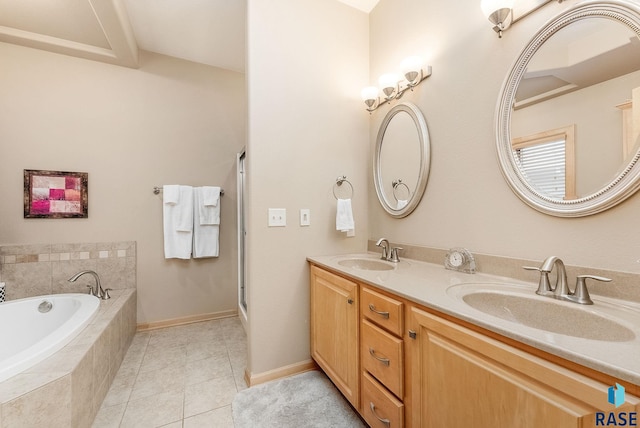 bathroom with tile patterned floors, independent shower and bath, and vanity