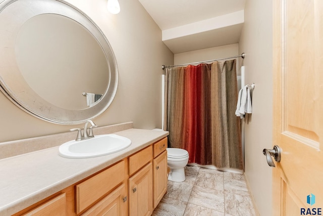 bathroom featuring vanity, toilet, and a shower with shower curtain