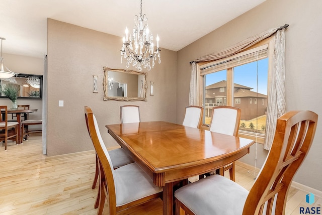 dining space featuring light wood-type flooring