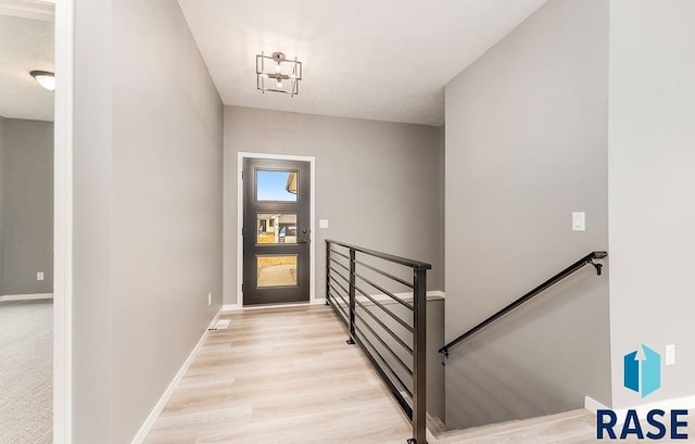 stairs featuring wood-type flooring