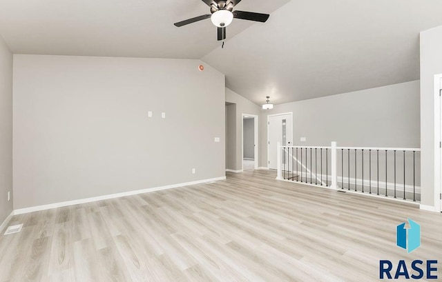 unfurnished room featuring lofted ceiling, light hardwood / wood-style flooring, and ceiling fan