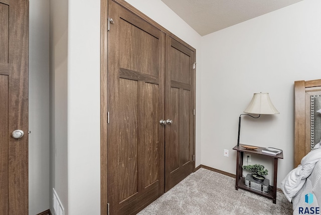 interior space featuring light colored carpet