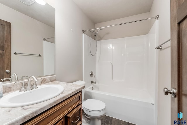 full bathroom with shower / bathtub combination, vanity, toilet, and wood-type flooring