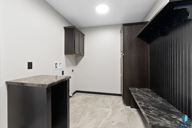 laundry area featuring electric dryer hookup, washer hookup, and cabinets