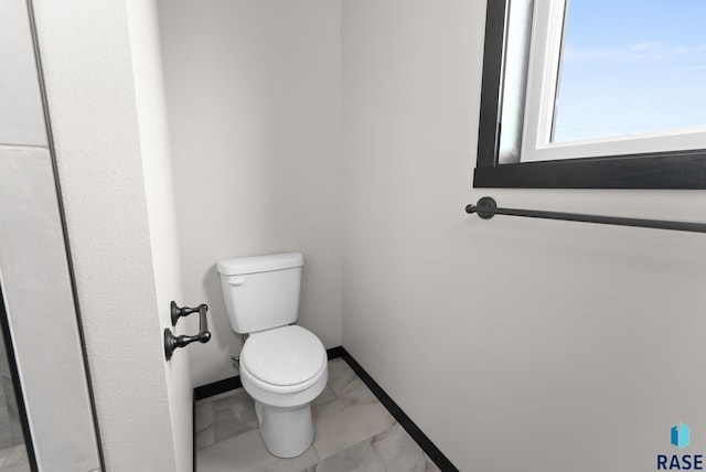 bathroom featuring toilet