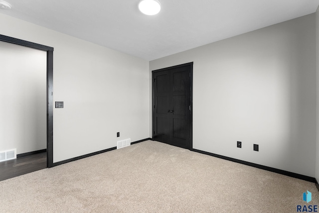 unfurnished bedroom with carpet flooring