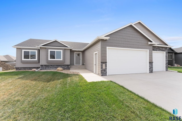 view of front of house with a garage and a front yard