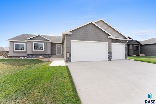 craftsman-style home featuring a garage and a front yard