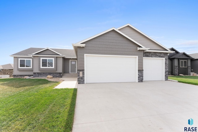 craftsman-style home with a garage and a front yard