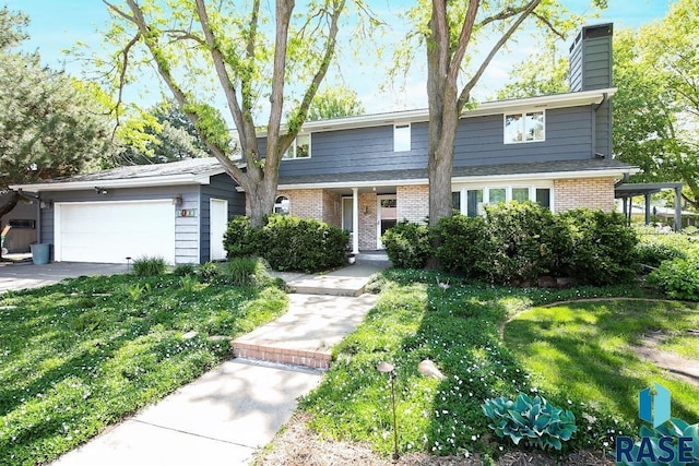 view of front facade featuring a garage and a front lawn