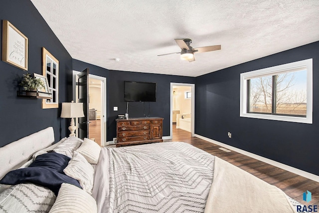 bedroom with ceiling fan, a textured ceiling, baseboards, and wood finished floors