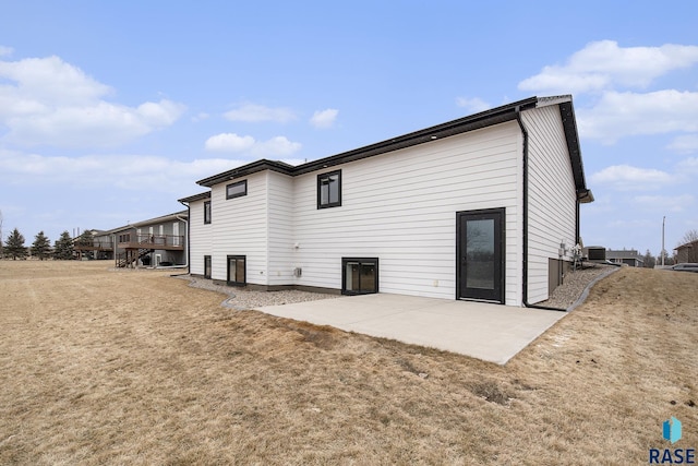 rear view of house featuring a patio