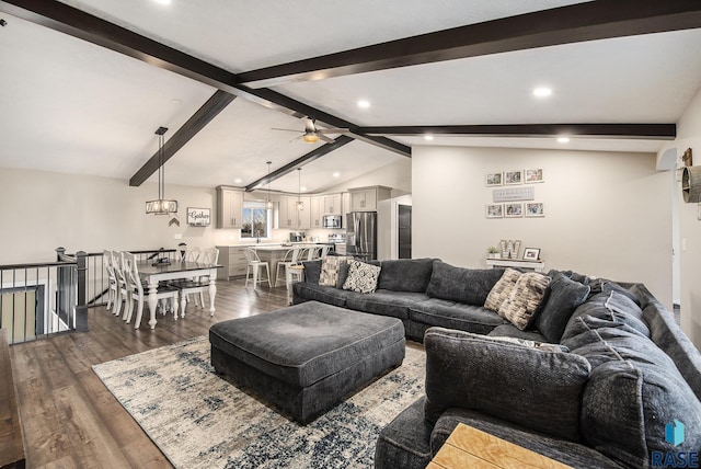 living area with lofted ceiling with beams, ceiling fan, dark wood finished floors, and recessed lighting