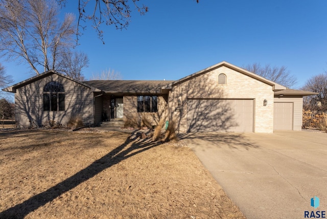 ranch-style home featuring a garage