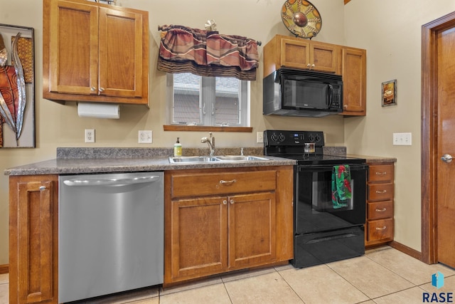 kitchen with sink, light tile patterned floors, and black appliances