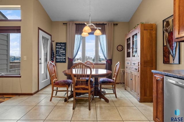 tiled dining room with a healthy amount of sunlight