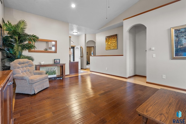 living room with hardwood / wood-style flooring and lofted ceiling