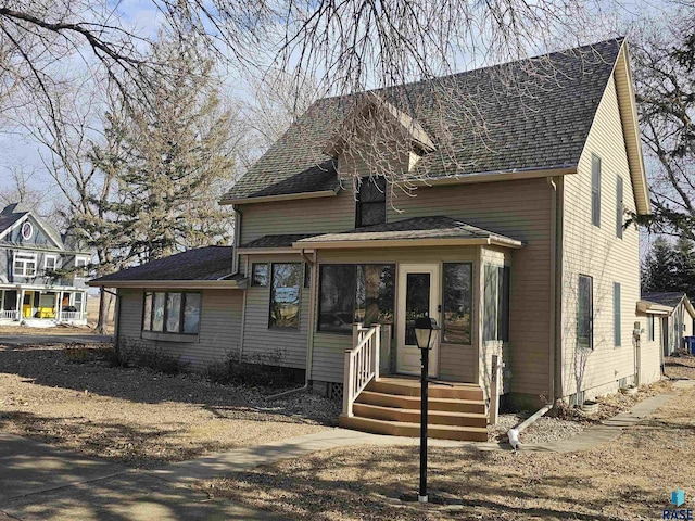 view of front of house featuring a sunroom