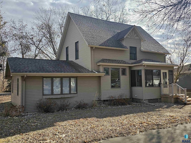 view of front facade featuring a sunroom