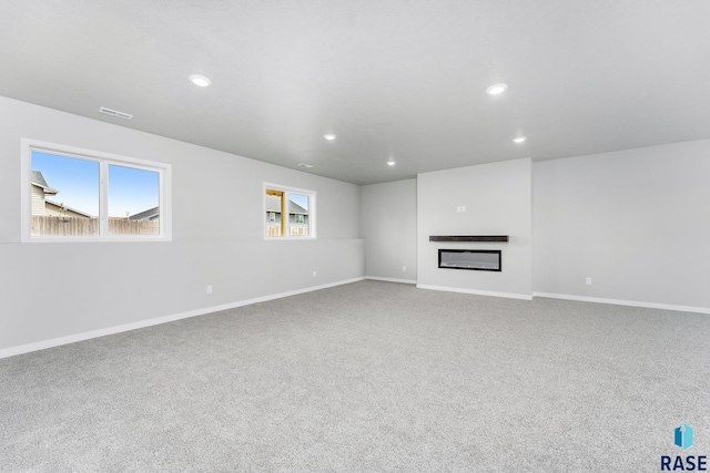 unfurnished living room with carpet