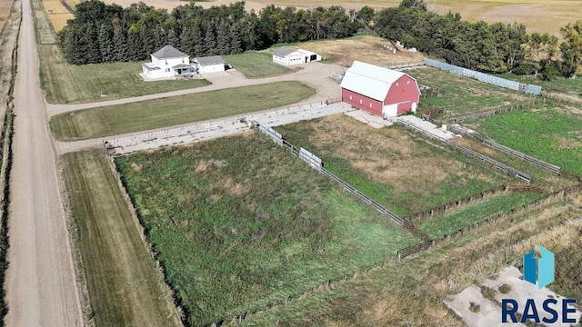 birds eye view of property with a rural view