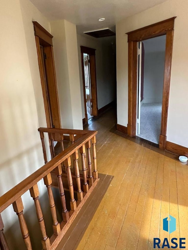 stairs with hardwood / wood-style flooring