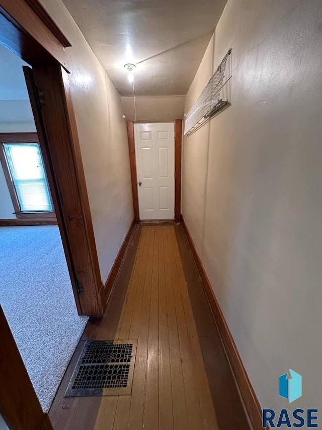 hallway featuring wood-type flooring