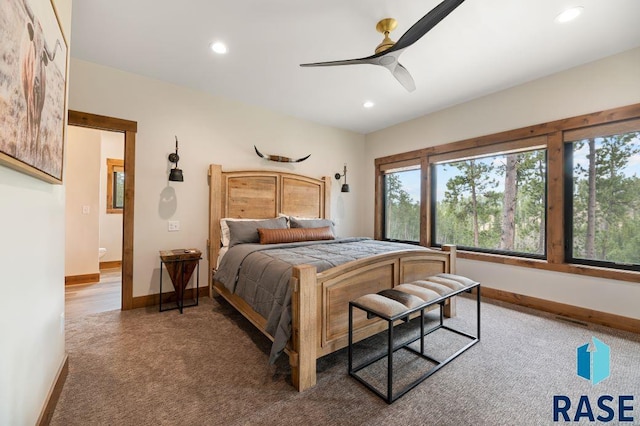 bedroom with ceiling fan and carpet