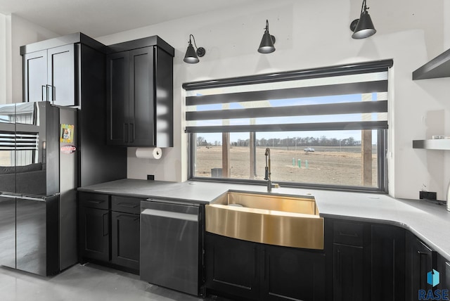 kitchen with black fridge, dishwasher, and sink