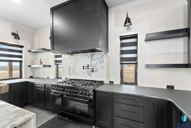 kitchen featuring tasteful backsplash, double oven range, and premium range hood