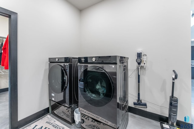 laundry area featuring washing machine and clothes dryer